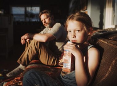 child drinking juice high in sugar