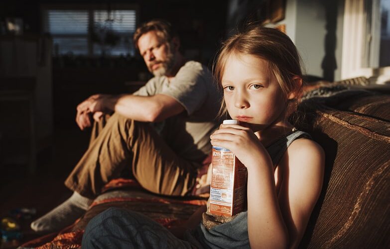 child drinking juice high in sugar