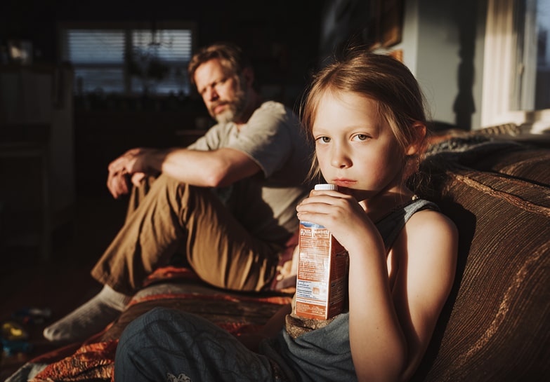 child drinking juice high in sugar
